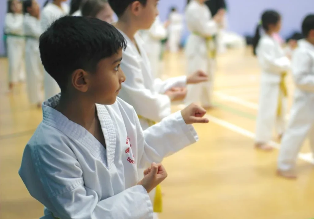 Young boy practices punches